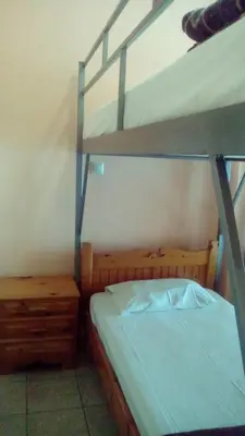 a bedroom with a bunk bed and a bunk ladder at Constantinos Budget Beds in Chania Town