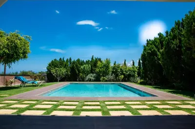 a swimming pool in the yard of a house at Villa Dimokratia in Kolymvari