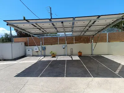 a parking lot with awning on top of a building at Villa Dimokratia in Kolymvari