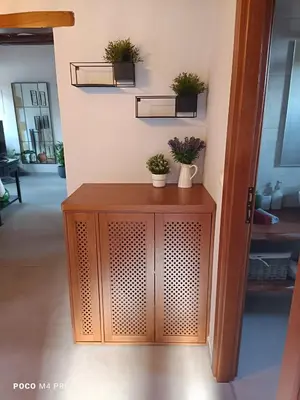 a room with a wooden cabinet with potted plants on it at Alia Stone Villa-Ideal for families-Heated pool in Nohia