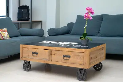 a coffee table with a flower on top of it at Stefan's City Loft in Chania Town