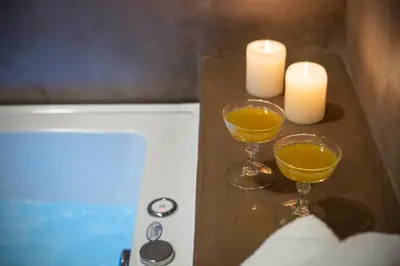 two glasses of orange juice and candles on a counter at Villa Christini in Kissamos