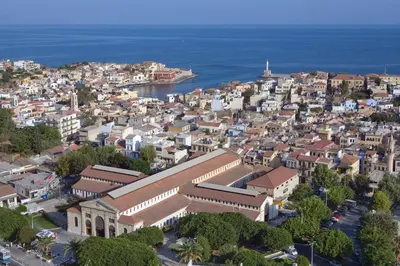 an aerial view of a city with a ship at C&M Residence Chania Old Town in Chania Town