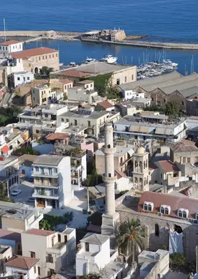 an aerial view of a town with a clock tower at C&M Residence Chania Old Town in Chania Town