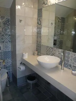 a bathroom with a sink and a toilet at C&M Residence Chania Old Town in Chania Town