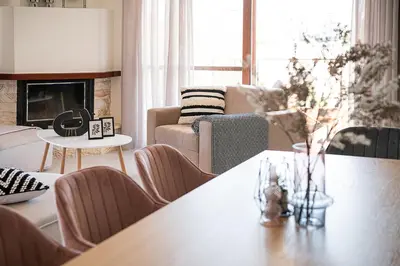 a living room with a table and a couch at Elia Seaside in Chania Town