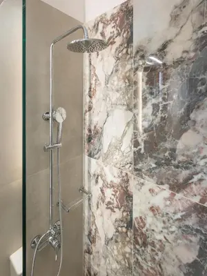 a shower with a glass door in a bathroom at Porto Orion Studios in Chania Town