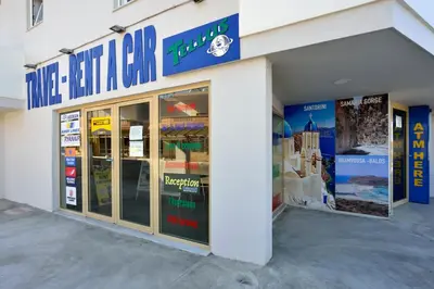 a store front of a building with glass doors at Kalamaki Apartments in Kalamaki Chanion