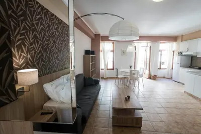a living room with a couch and a table at Horizon Deluxe House in Chania Town