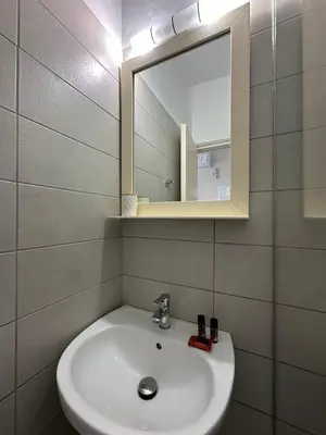 a bathroom with a sink and a mirror at Electra Studios in Gerani Chanion