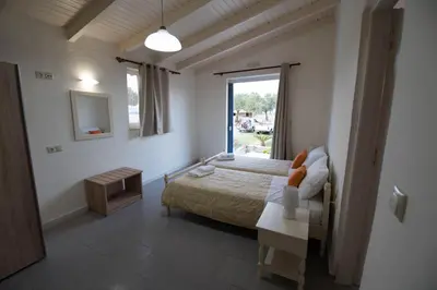 a bedroom with a bed and a window at Electra Studios in Gerani Chanion