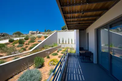 a balcony of a house with a view of the desert at Seametry Luxury Living Apartments ADULTS ONLY in Souda