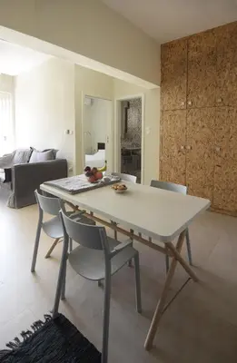 a white table and chairs in a living room at Christini Apartment in Chania Town