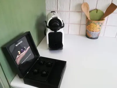 a kitchen counter with a small stove with a tv on it at Ktima Grammeno Beachside Villa in Palaiochóra