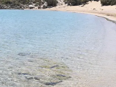 a large body of water with a sandy beach at Ktima Grammeno Beachside Villa in Palaiochóra