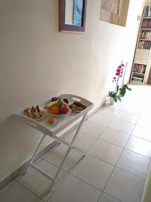 a white table with a tray of food on it at Odyssey Studios in Chania Town
