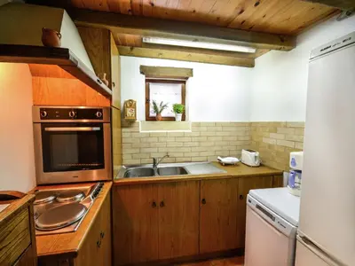 a kitchen with a sink and a stove top oven at Villa in Crete with Vineyard Experience in Kalamítsion Alexándrou