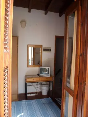 a room with a desk with a television on it at Hera Studios in Chania Town