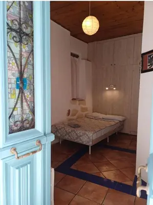 a room with a bed in the corner of a room at Hera Studios in Chania Town