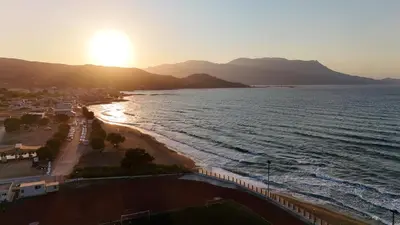 an aerial view of a beach at sunset at Galini Beach Hotel in Kissamos