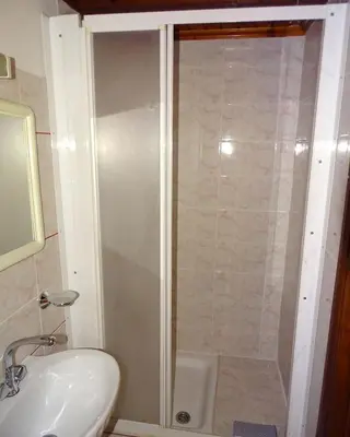 a bathroom with a shower and a sink at Anemones Rooms in Chania Town