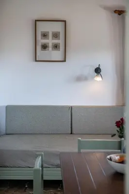 a living room with a couch and a table at Androulakis Apartments in Gerani Chanion