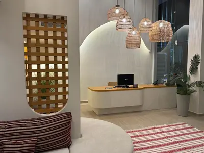 an office with a desk with a computer on it at Τhe Noverian Antama Organic Beach Resort Chania with Outdoor Heated Pool in Agia Marina Nea Kydonias