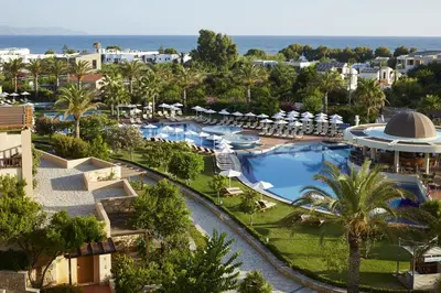 an aerial view of a resort with a swimming pool at Minoa Palace Resort in Plataniás