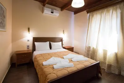 a bedroom with a bed with towels on it at PRIVATE Sapphiros Villa in Kissamos