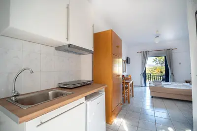 a kitchen with a sink and a counter top at Maria's Studios in Frangokastello