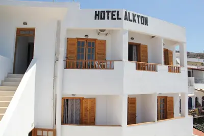 a white building with a hotel adviser sign on it at Hotel Alkyon in Khóra Sfakíon