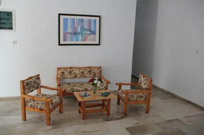 a living room with two chairs and a table at Hotel Alkyon in Khóra Sfakíon