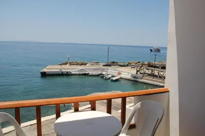 a balcony with a view of a marina at Hotel Alkyon in Khóra Sfakíon