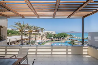 a view of the pool from the balcony of a resort at Cretan Dream Resort & Spa in Stalos