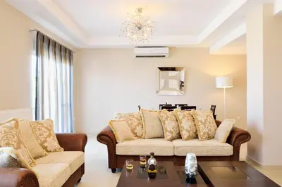 a living room with two couches and a table at Elia Kounoupidiana Apartment in Kounoupidhianá