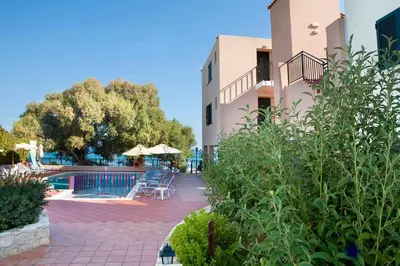 a resort with a pool and a building at Margarita Beach Hotel in Agia Marina Nea Kydonias