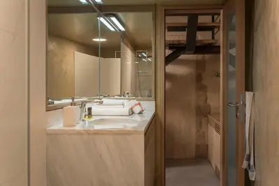 a bathroom with a sink and a mirror at Neoria Houses in Chania Town