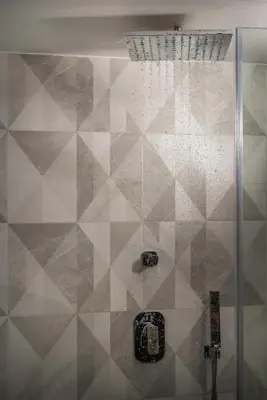 a shower with a glass door in a bathroom at Residenza Vranas Boutique Hotel in Chania Town