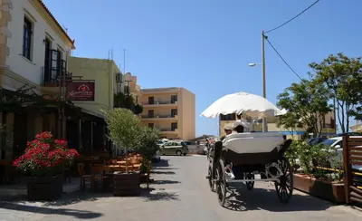 a horse drawn carriage parked on a city street at Casa Sabbionara in Chania Town