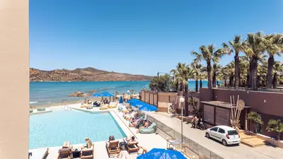 a view of a resort with a pool and a beach at Chrispy Beach Resort, Agia Marina in Agia Marina Nea Kydonias