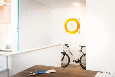 a bike parked in a room with a table at Kissamia - Self Check In Only - Next to Night Clubs in Kissamos