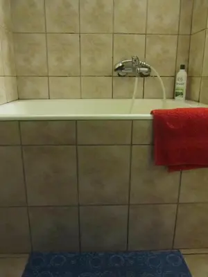 a bathroom with a sink and a red towel at Economy Studio Apartments in Chania Town