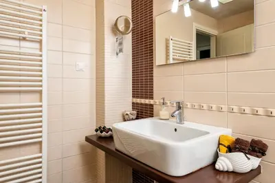 a bathroom with a white sink and a mirror at Dream Villa in Kambánion