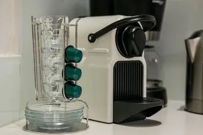 a toaster sitting on a counter next to a glass cup at Casa Kallergi in Chania Town