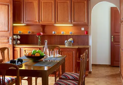 a kitchen with a table with a bowl of fruit on it at Villa Mare in Tersanas