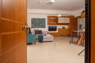 a living room with a couch and a table at Contemporary 2 bedroom apt 5 min walk from Kissamos center in Kissamos