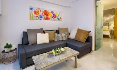 a living room with a couch and a table at Lithinon House in Chania Town