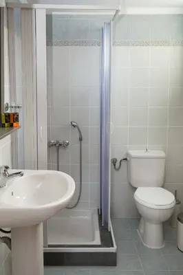 a bathroom with a sink and a toilet and a shower at Gelina Apartments in Plataniás