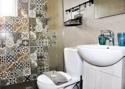 a bathroom with a toilet and a sink at Villa Lakki Heated round pool Jacuzzi in Lákkoi