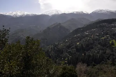 a view of a mountain valley with snow capped mountains at Villa Lakki Heated round pool Jacuzzi in Lákkoi